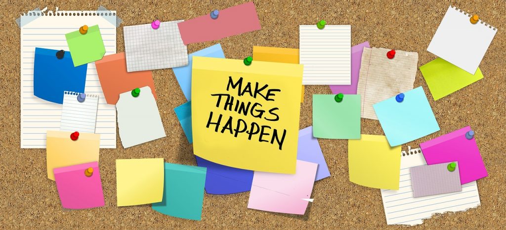 Post-its on a notice board encouraging the message to "Make Things Happen" Picture accompanies a Lisa Crow VA blog titled The News That Changed My Life Forever